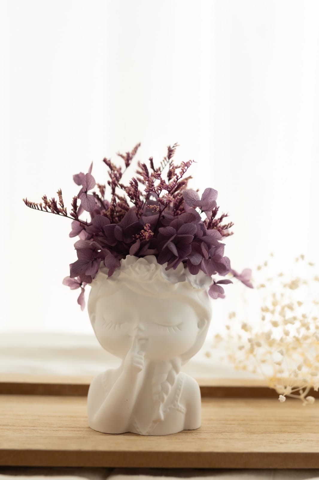 Scented plaster doll with preserved flowers