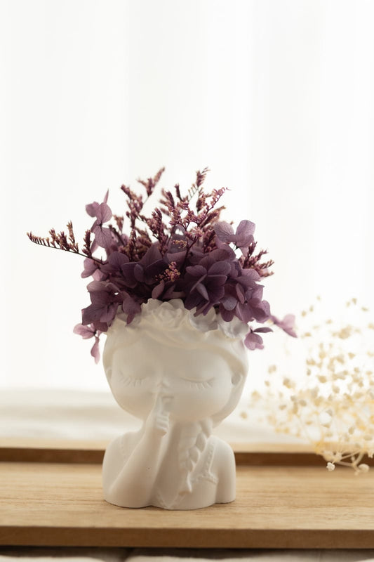 Scented plaster doll with preserved flowers