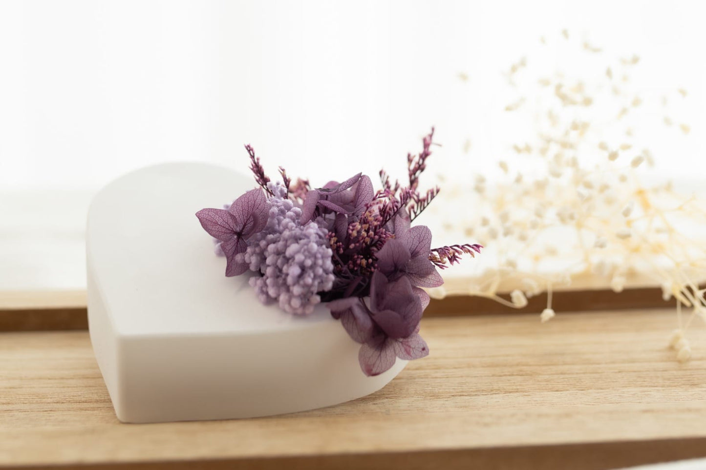 A plaster heart scented with preserved flowers.